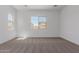 This bedroom is filled with natural light from the windows and has neutral carpet at 21846 E Bonanza Ct, Queen Creek, AZ 85142