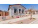 Charming single-story home with manicured landscaping and a stone driveway at 21846 E Bonanza Ct, Queen Creek, AZ 85142