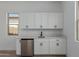 Room with sink, beverage fridge, and white shaker cabinets at 21846 E Bonanza Ct, Queen Creek, AZ 85142