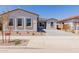 Charming single-story home with desert landscaping, a tile roof, and a paved driveway at 21846 E Bonanza Ct, Queen Creek, AZ 85142