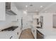Contemporary kitchen with white cabinets, stainless steel appliances, and a large center island at 21846 E Bonanza Ct, Queen Creek, AZ 85142