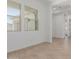 Bright living room with wood-look tile floors and two large windows at 21846 E Bonanza Ct, Queen Creek, AZ 85142
