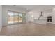 Open-concept living area with tile floors and sliding glass doors leading to the backyard at 21846 E Bonanza Ct, Queen Creek, AZ 85142