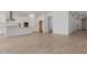 Bright open-concept living space featuring tile floors with the kitchen in the background at 21846 E Bonanza Ct, Queen Creek, AZ 85142
