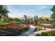 Community playground with swings, slides, and climbing structures provides a fun and active space for children at 2304 W Storia Ave, Apache Junction, AZ 85120