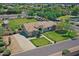 An aerial view showcasing the home, lush greenery, and well-manicured lawn at 23455 S 199Th Pl, Queen Creek, AZ 85142