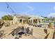 Enjoy a backyard pool, patio, lounge chairs, and fire pit with built in seating; the perfect space to entertain! at 23455 S 199Th Pl, Queen Creek, AZ 85142