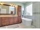 Bathroom with vanity, soaking tub, modern fixtures, and seamless glass shower at 23455 S 199Th Pl, Queen Creek, AZ 85142