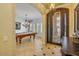 Welcoming foyer with a decorative front door and a glimpse into the billiard room at 23455 S 199Th Pl, Queen Creek, AZ 85142