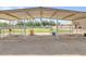 An outdoor horse shelter with metal framing, providing ample space for livestock at 23455 S 199Th Pl, Queen Creek, AZ 85142