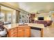 Open-concept kitchen flowing into a living area, complete with granite countertops and a view to the yard at 23455 S 199Th Pl, Queen Creek, AZ 85142