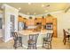 Well-equipped kitchen with stainless steel appliances and a breakfast bar at 23455 S 199Th Pl, Queen Creek, AZ 85142