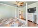 Main bedroom offering ample space with a TV, dresser, and access to other rooms at 23455 S 199Th Pl, Queen Creek, AZ 85142