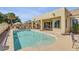 Inviting backyard pool with ample lounge space, mature landscaping, and backyard access from the home at 23455 S 199Th Pl, Queen Creek, AZ 85142