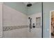 Modern shower with neutral tile, built-in niche, and sleek black fixtures at 23455 S 199Th Pl, Queen Creek, AZ 85142