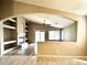 Inviting open-concept living room with fireplace, built-ins, and sliding glass doors at 2409 N 112Th Ln, Avondale, AZ 85392