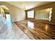 The living room is a bright and inviting space with wood flooring and an accent wall at 2409 N 112Th Ln, Avondale, AZ 85392