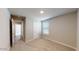 Bedroom featuring a window, neutral paint, and an attached hallway at 2509 W Seaver Ave, Apache Junction, AZ 85120