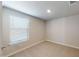 Cozy bedroom with neutral carpet, a window with blinds, and fresh paint at 2509 W Seaver Ave, Apache Junction, AZ 85120