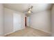 Bedroom with neutral carpet, a ceiling fan, and ample natural light at 2509 W Seaver Ave, Apache Junction, AZ 85120