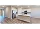 Bright kitchen features an island, stainless steel appliances, and modern finishes at 2509 W Seaver Ave, Apache Junction, AZ 85120