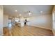 Open-concept living room features hardwood flooring and natural light with an open kitchen at 2509 W Seaver Ave, Apache Junction, AZ 85120