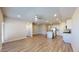 Spacious living room featuring wood floors, a ceiling fan, and an open layout to the kitchen at 2509 W Seaver Ave, Apache Junction, AZ 85120