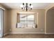 Dining area featuring a window seat and a chandelier at 252 S Canfield --, Mesa, AZ 85208