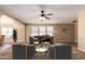 Bright living room featuring a ceiling fan, neutral color scheme, and multiple windows at 252 S Canfield --, Mesa, AZ 85208