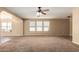 Spacious living room with a ceiling fan and a view of the dining area at 252 S Canfield --, Mesa, AZ 85208