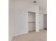 Bedroom closet with sliding doors and metal rack for clothes storage at 25308 N 133Rd Ave, Peoria, AZ 85383
