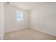 A clean bedroom features neutral carpet, a window and electrical outlets at 25308 N 133Rd Ave, Peoria, AZ 85383