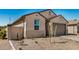 Side view of single story home with desert landscaping and block fence, offering privacy and curb appeal at 25308 N 133Rd Ave, Peoria, AZ 85383