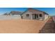 Picture of a large backyard with a block fence and view of the home's exterior at 25314 N 133Rd Ave, Peoria, AZ 85383