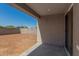 View of a spacious backyard with concrete patio and block fencing, ready for landscaping at 25314 N 133Rd Ave, Peoria, AZ 85383