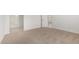 Bedroom with neutral carpet adjacent to a bathroom with a glass shower enclosure at 25314 N 133Rd Ave, Peoria, AZ 85383