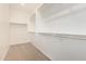 Walk-in closet featuring carpet and multiple tiers of shelving at 25314 N 133Rd Ave, Peoria, AZ 85383