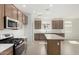 Elegant kitchen featuring stainless steel appliances, cabinetry, and tile flooring at 25314 N 133Rd Ave, Peoria, AZ 85383