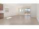 Open-concept living area featuring tile floors and natural light from the sliding doors at 25314 N 133Rd Ave, Peoria, AZ 85383