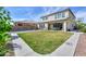 Expansive backyard with a pool, covered patio, and ample green space, perfect for outdoor activities at 277 W Glacier Bay Dr, San Tan Valley, AZ 85140
