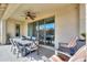 Comfortable outdoor patio with dining and lounge seating, with a view through to the spacious backyard at 277 W Glacier Bay Dr, San Tan Valley, AZ 85140