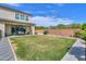 Large backyard with lush lawn and covered patio, offering an ideal space for relaxation and recreation at 277 W Glacier Bay Dr, San Tan Valley, AZ 85140