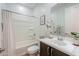 Clean bathroom featuring a shower-tub combo and a modern vanity with ample counter space at 277 W Glacier Bay Dr, San Tan Valley, AZ 85140