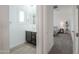 Bright bathroom with dark vanity, double sinks and neutral decor, creating a clean and modern space at 277 W Glacier Bay Dr, San Tan Valley, AZ 85140