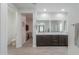 Bright bathroom with double sinks and a sleek shower, with a toilet room at 277 W Glacier Bay Dr, San Tan Valley, AZ 85140