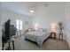 Bedroom featuring a gray comforter, side tables and neutral decor for a relaxing and inviting space at 277 W Glacier Bay Dr, San Tan Valley, AZ 85140