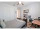 Comfortable bedroom with ample natural light, closet space, and a dedicated desk area at 277 W Glacier Bay Dr, San Tan Valley, AZ 85140