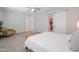 Large primary bedroom featuring a ceiling fan and comfortable sitting area at 277 W Glacier Bay Dr, San Tan Valley, AZ 85140