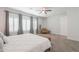 Brightly lit primary bedroom offering a large window and an accent chair at 277 W Glacier Bay Dr, San Tan Valley, AZ 85140