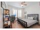 Cozy bedroom with neutral tones, a ceiling fan, and a functional workspace at 277 W Glacier Bay Dr, San Tan Valley, AZ 85140